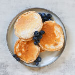 Three pancake on a plate.