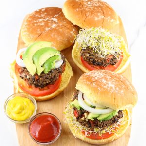 Cutting board with black bean burgers.