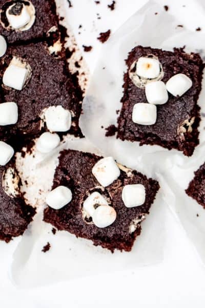 Hot Chocolate Cake Bars - A gluten free holiday or anytime treat the entire crowd will enjoy! Lightened up with half the sugar of a traditional cake bar, this recipe is sure to satisfy a sweet tooth, healthfully! #glutenfreetreats #hotchococolatebars #hotcocoabars #healthyholidaytreats #cookiesforsanta