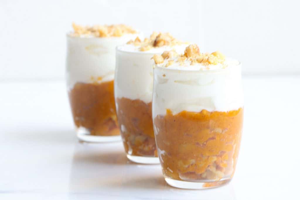 three sweet potato breakfast parfaits lined up in a row