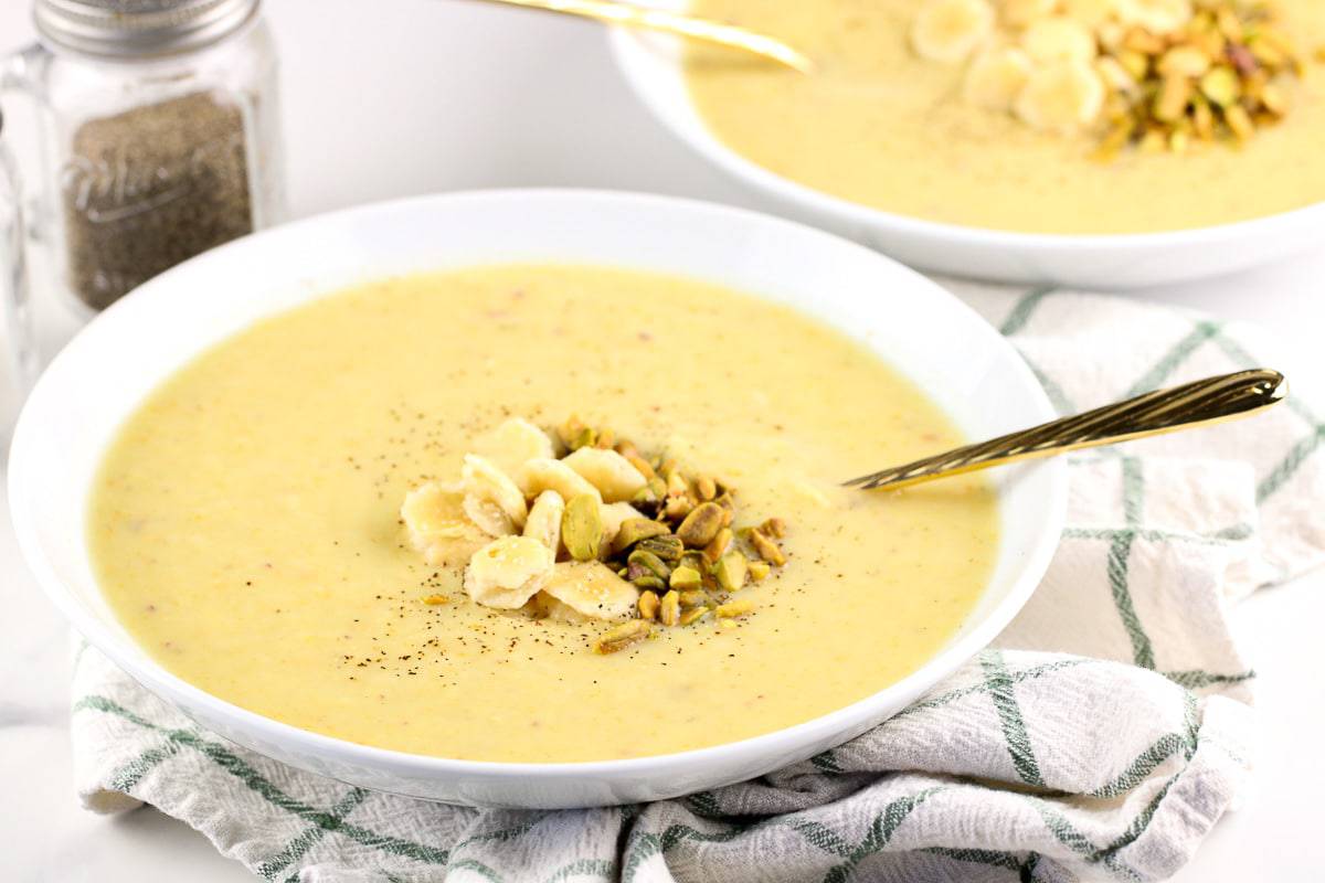 Image of potato soup in a bowl with a spoon.