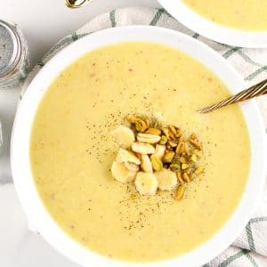 Image of potato soup in a bowl with salt and pepper.