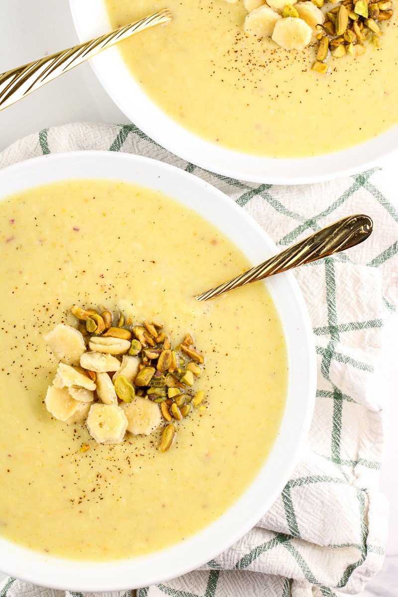 Image of potato soup with pistachios on top.