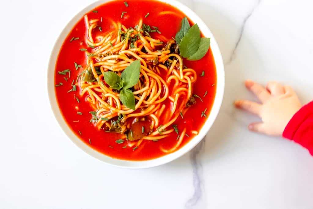 Tomato Soup Pasta with Kale is a simple, vegan dish that the entire family can enjoy. Make It from scratch or simple swap some time with using a canned soup. Either way, the end product is delicious! You'll also find suggestions to modify for a gluten-free diet and high protein soup. #tomatosoup #healthytomatosoup #vegansouprecipes