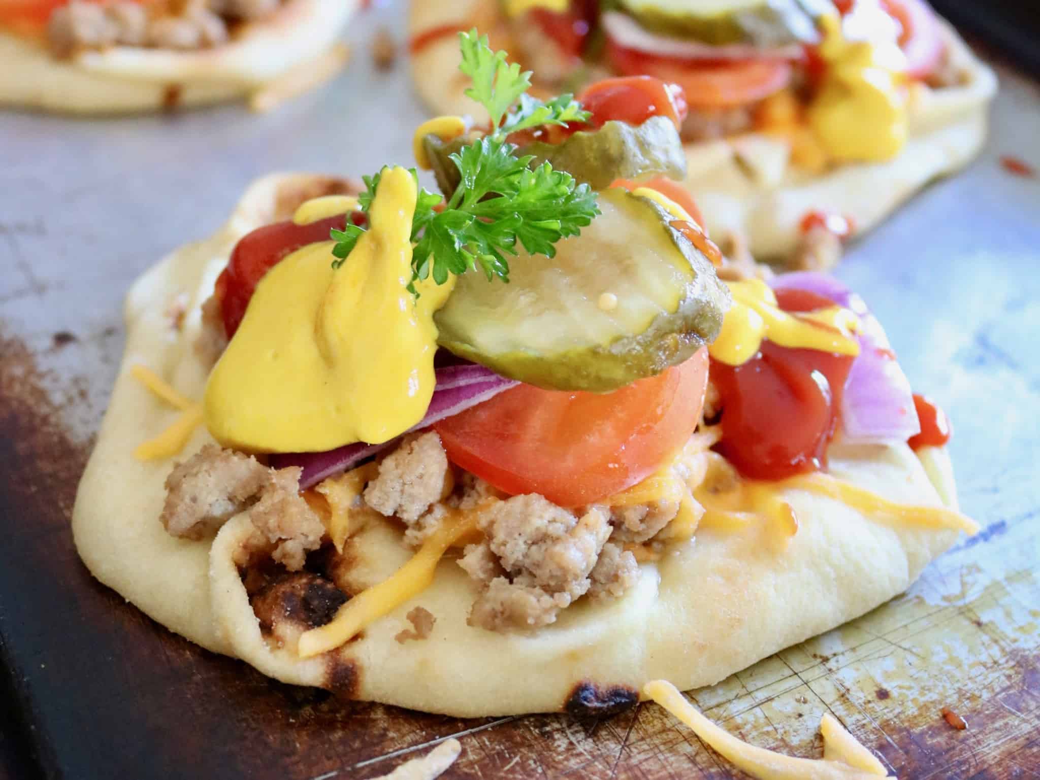 Cheeseburger Naan Pizza - A healthier way to enjoy two of your favorite comfort foods! @shawsimpleswaps