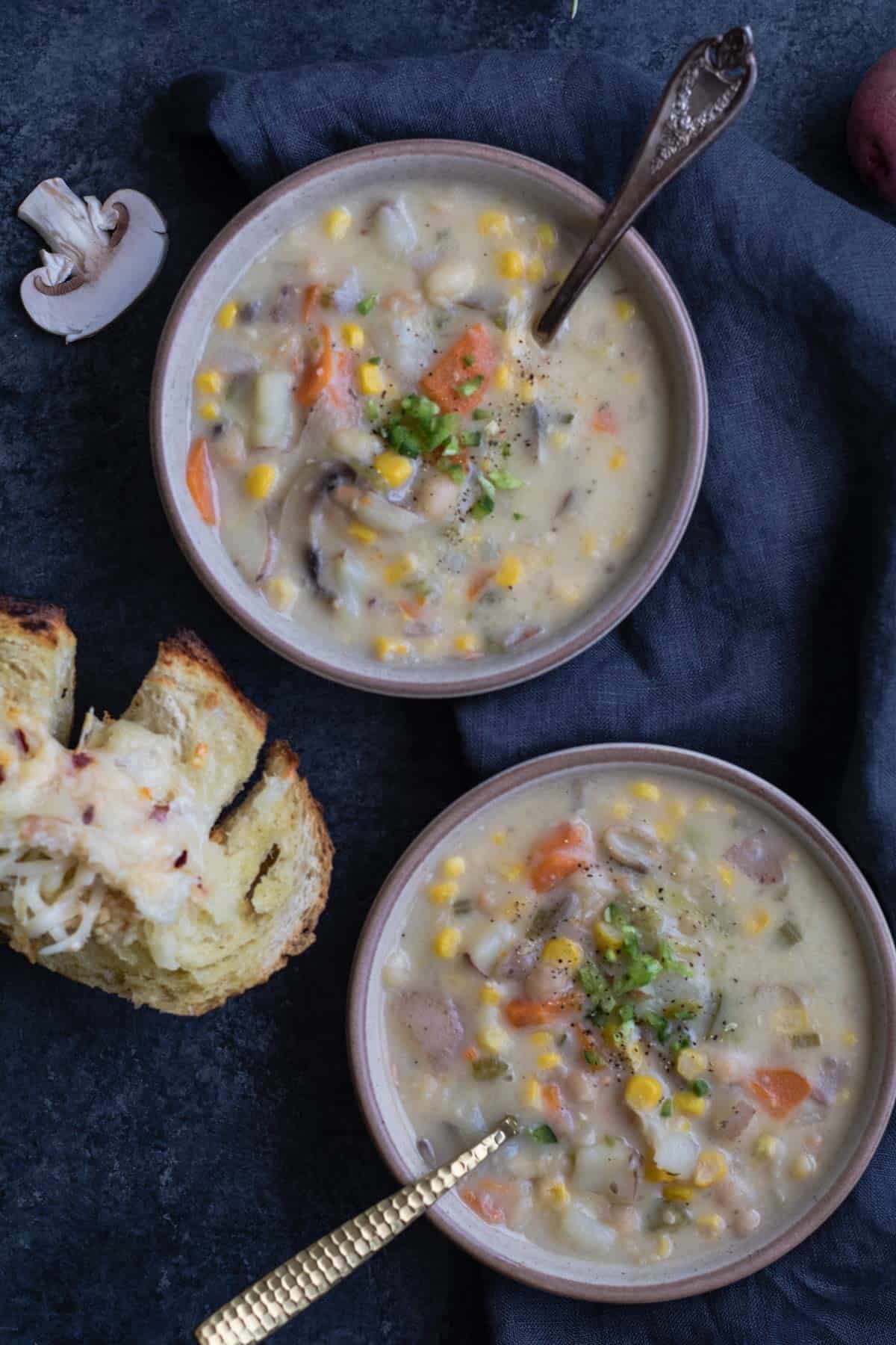 Tawnie Kroll image of corn chowder soup with black background.