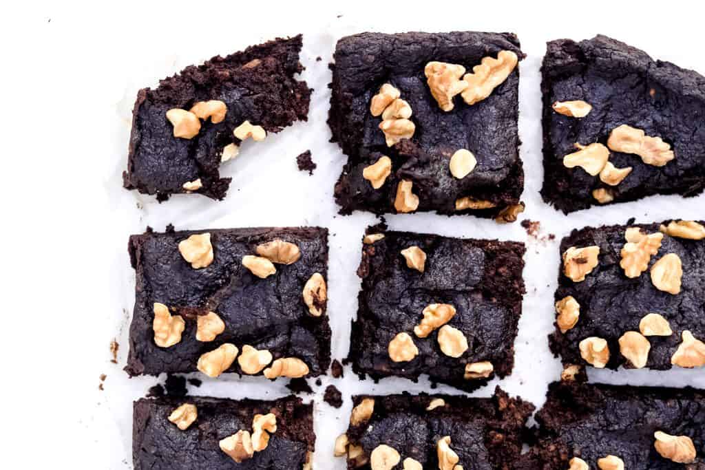 Gluten Free Brownie Recipe - A delicious, blender brownie recipe that's naturally gluten free, dairy free, artificial sugar free and actually delicious. No sponge like tasting brownies here! This pecan flour base will have your entire crowd asking for more! #glutenfreebrownies #brownierecipe #blenderbrownies #healthydesserts #dairyfreebrownies