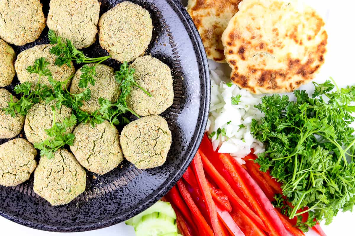 Veggie sides around falafel.