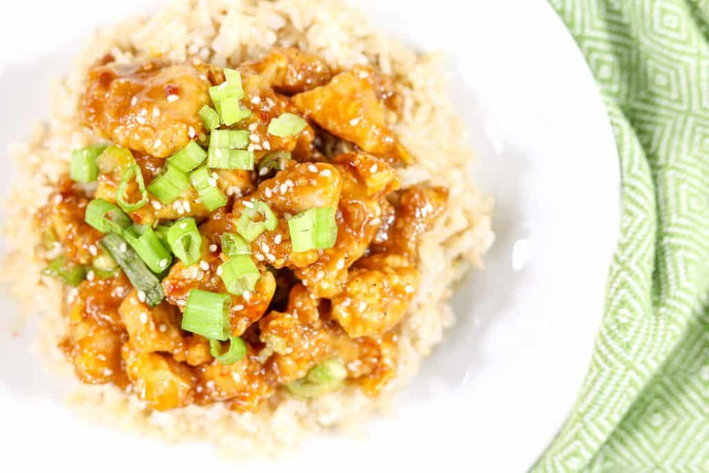 Plated orange chicken with rice.