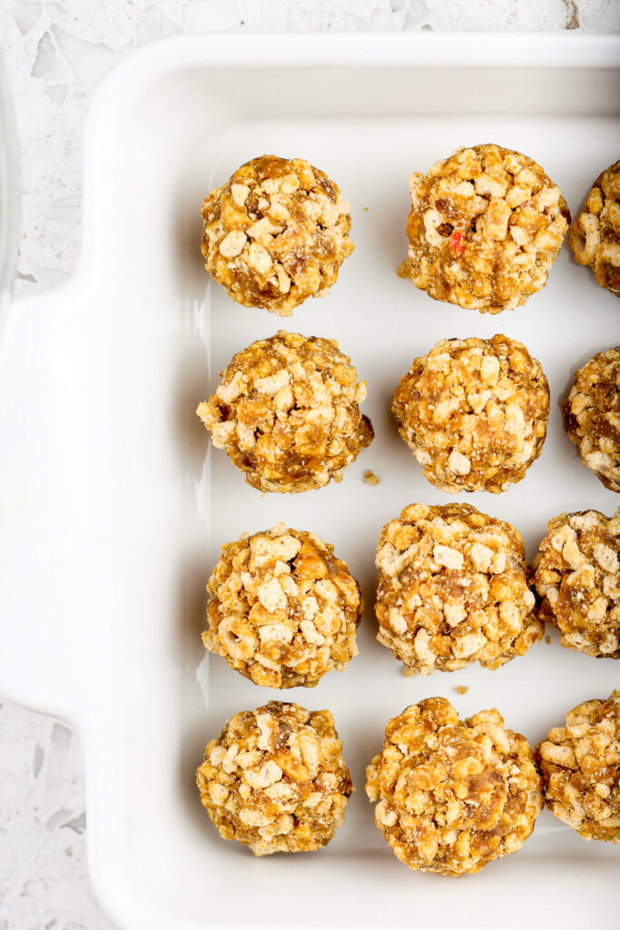 White square cake pan with one ounce brown cereal cake pops.