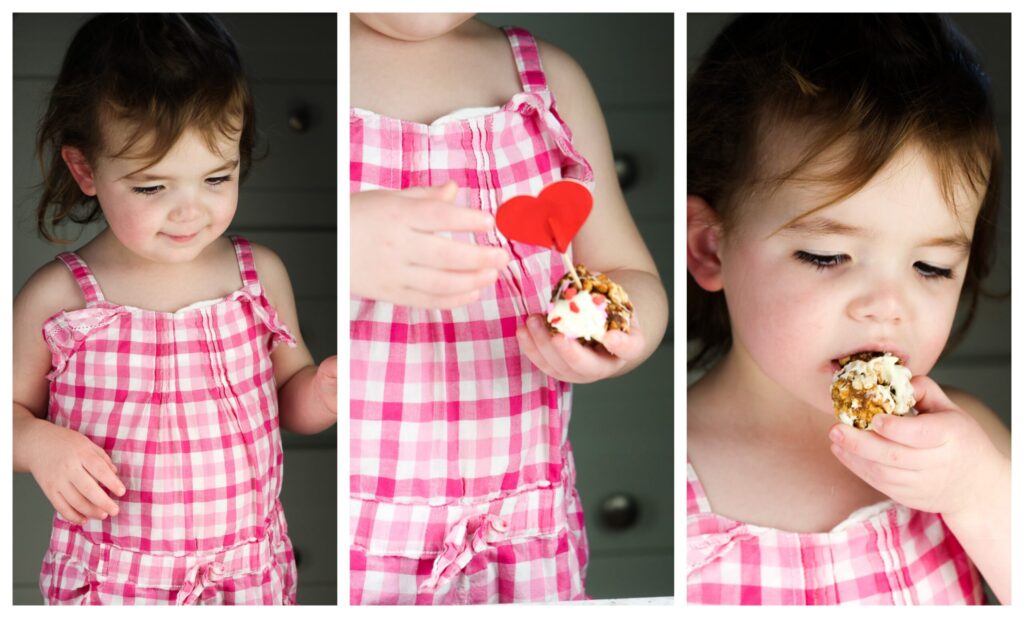 Toddler girl in pink checker board plaid smiling.