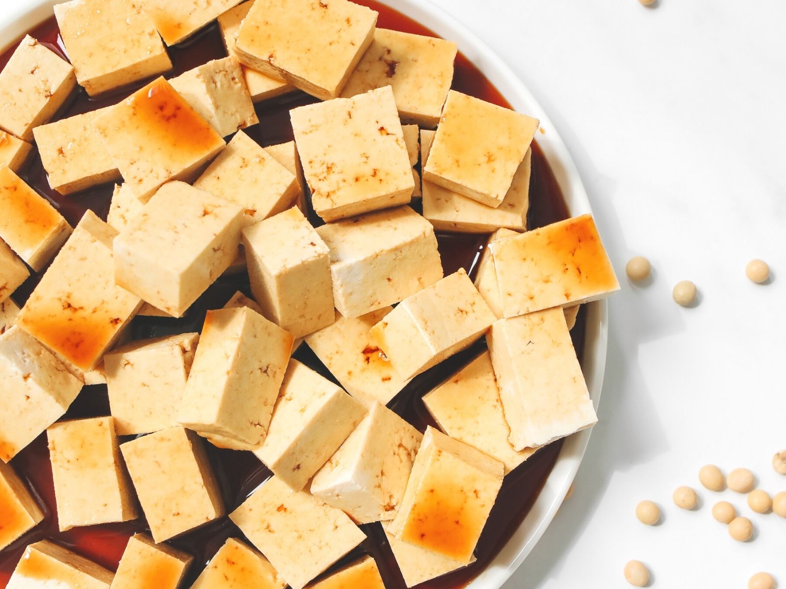 Marinated and cubed tofu in a bowl. 