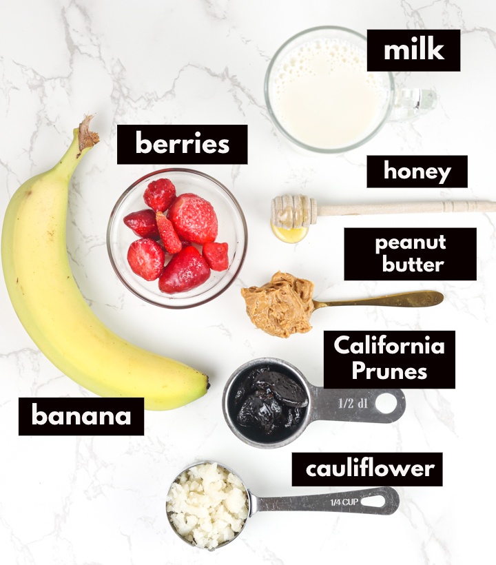 Ingredients labeled on large white backdrop for smoothie.